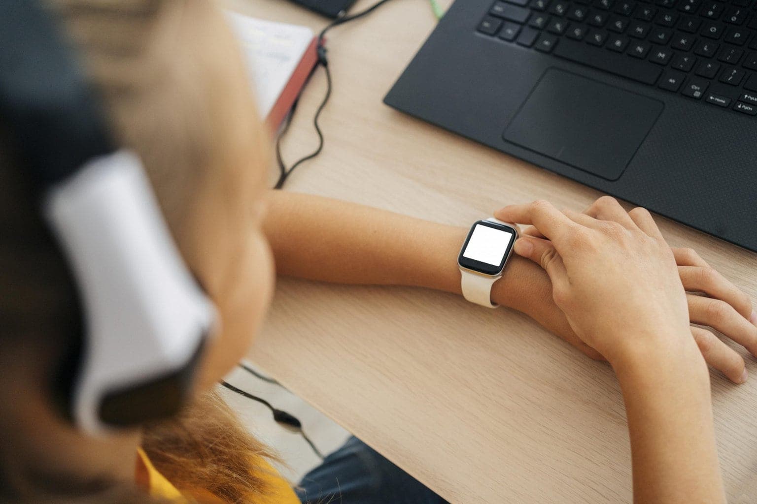close-up-young-girl-checking-her-smartwatch-scaled.jpg